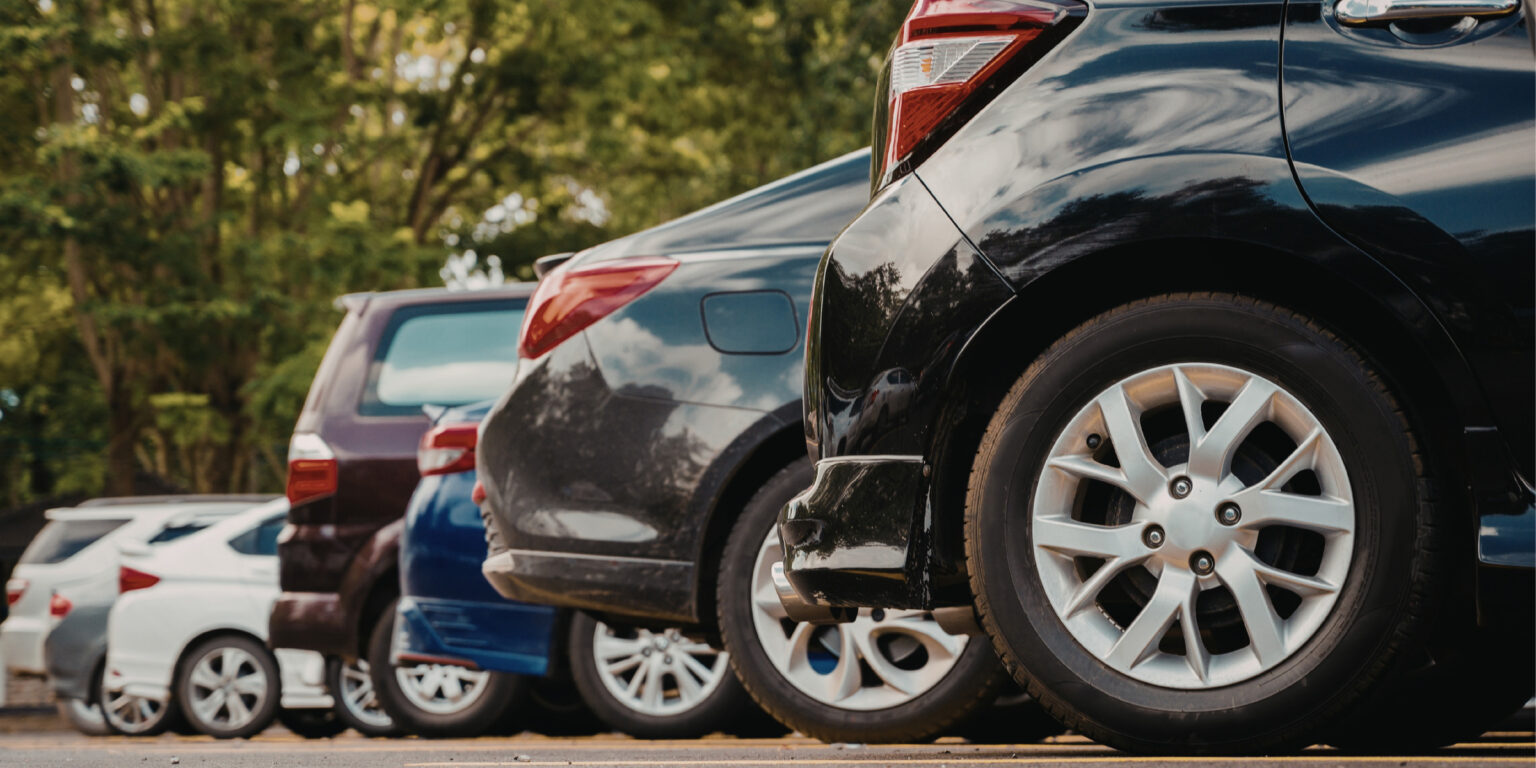 City Council Approves Pilot Program to Evaluate Downtown Parking Strategies A photo of a line of cars parked in a lot.