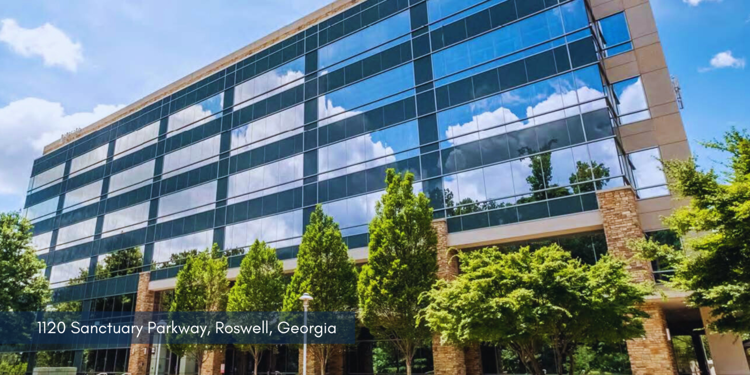 This is a photo of an office building located at 1120 Sanctuary Parkway, the location of CRH's new location in Roswell, GA.